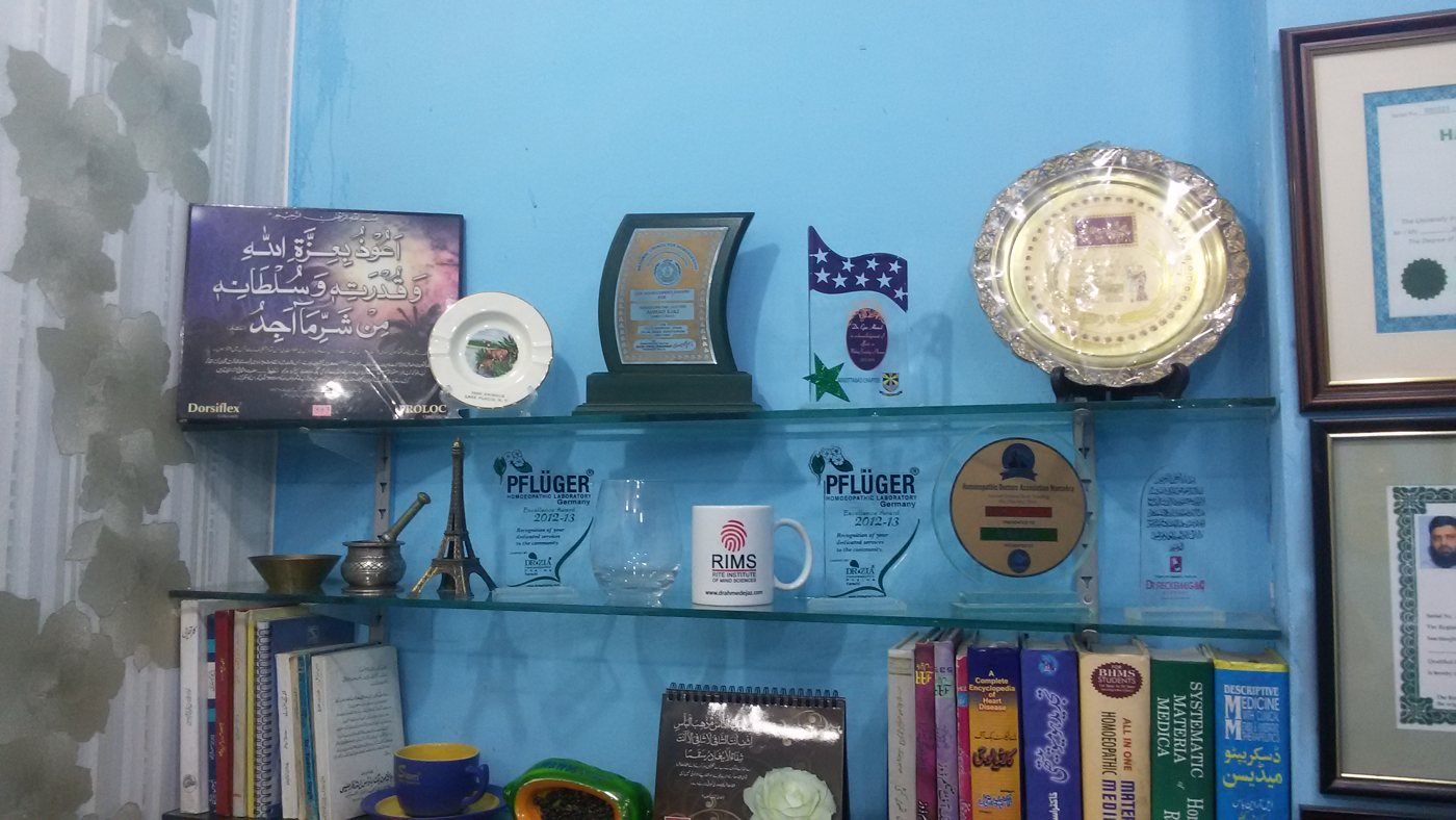 A shelf of awards including Pflüger Excellence Awards 2012–13