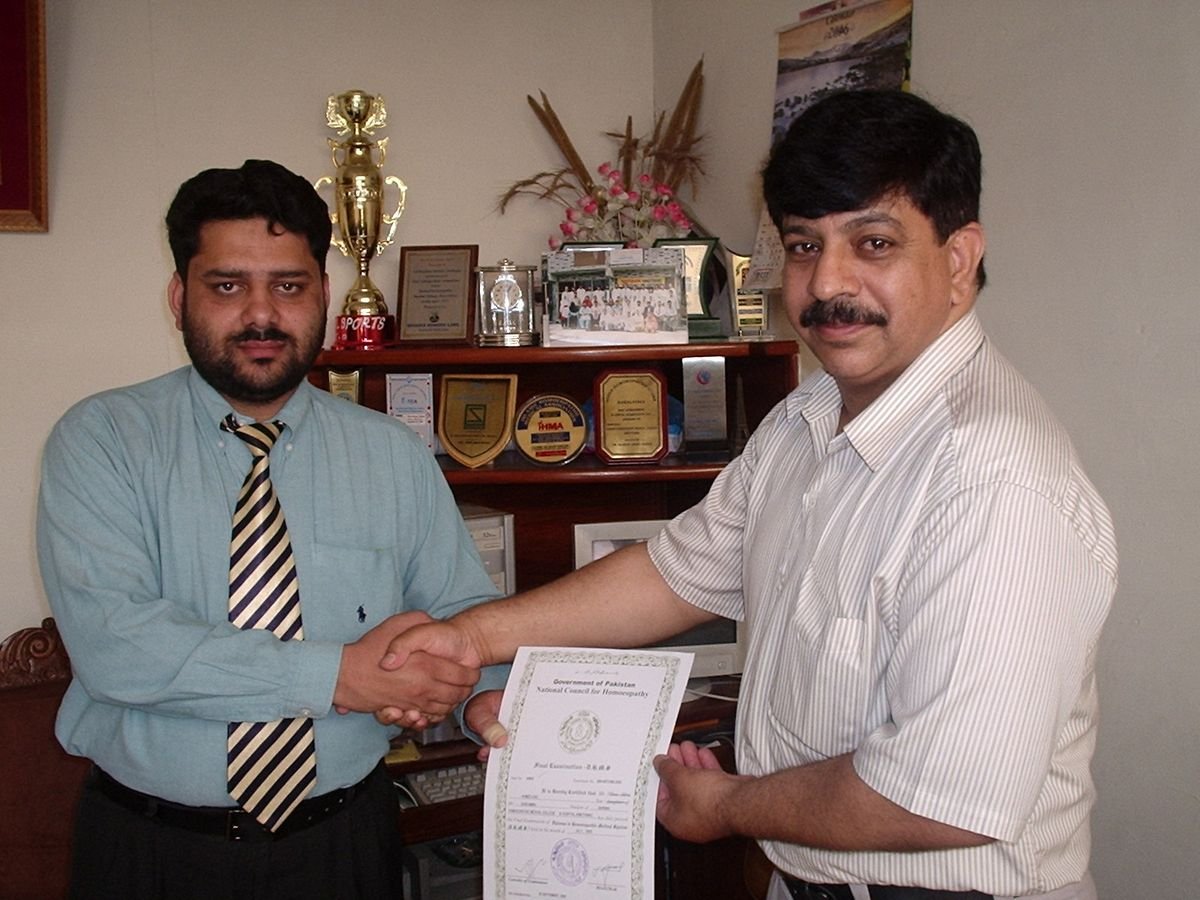 Ahmed Ejaz receiving his DHMS certificate